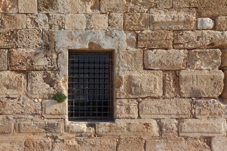 An ancient Crusader fortress  The window closed by a latticeの写真素材