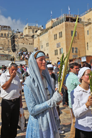 Jerusalem - October 16: The Holy Western Wall of the Temple. A young woman in a very beautiful...