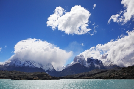Majestic rocks Los Kuernos on the bank of the lake are covered with glaciers  Magic turquoise lake Pehoe national park Torres del Paine, Chile  の写真素材