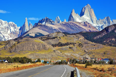 Famous rock Fitz Roy peaks in the Andes. Magnificent panorama of snow-capped mountains in Patagonia. To mountains leads the asphalt roadのeditorial素材