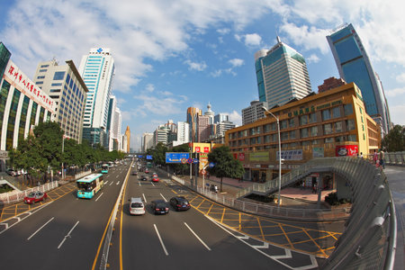  SHENZHEN -  CITY IN SOUTH OF  PEOPLE'S REPUBLIC OF CHINA - NOVEMBER 19, 2011:  The magnificent modern city with wide prospectuses and skyscrapers.On streets cars and buses goのeditorial素材