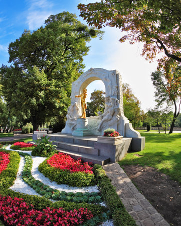 Elegant marble arch frames the bronze statue of Johann Strauss. Wonderful park in the center of Viennaのeditorial素材