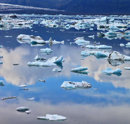 Transparent icebergs and ice floes in the Ice Lagoon Jokulsarlon. South-east Iceland in July