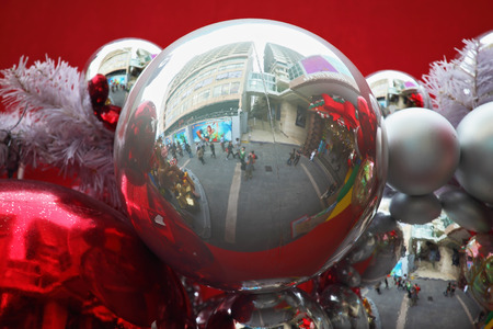 Magnificent garland from fur-tree toys. Bright red and silver glass spheres on a red background. Happy Christmas!の写真素材