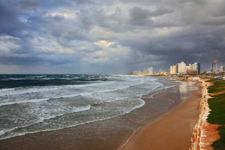 Storm at sunset in the Mediterranean. Promenade and beach in Tel Avivの写真素材