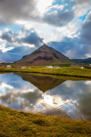 Quiet summer evening on Iceland. Sunset in the fishing village of Arnastapiの写真素材