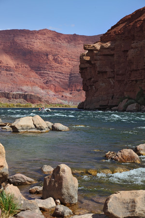 Company tourists on a kayak overcome rapid course of the Colorado Riverの写真素材