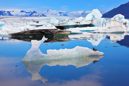 Ocean ice lagoon JÃ¶kulsÃ¡rlÃ³n. Azure ice  reflected in cold smooth waterの写真素材