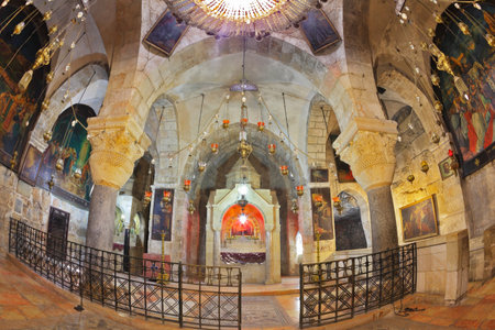 Jerusalem - September 3: Hall of the Holy Sepulchre in September 3, 2012 in Jerusalem. Ornate underground hall in the Temple. Marble columns, semicircular niche - the altar, ancient paintings of biblical scenesのeditorial素材
