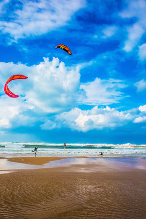 Tel Aviv January 1, 2016: Winter storm in the Mediterranean Sea. Kitesurfers ride the big and dangerous waves.のeditorial素材
