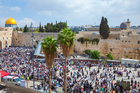 The Western Wall of the Temple. Autumn holiday of Sukkot in Jerusalem. At Temple Square was a huge...