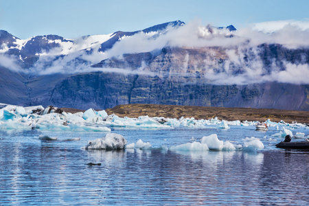 Ice lagoon in Iceland. Beautiful summer morning in the ocean bay with ice floes
