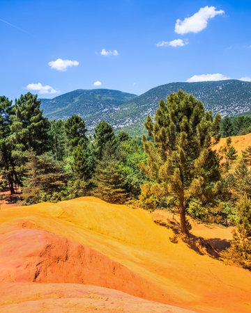South of France, Languedoc - Roussillon. Picturesque orange-yellow hills of the natural dye - ocher