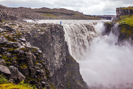 Sunset on a summer day, a magnificent rainbow in the water foam. Great Falls Dettifoss in Icelandの写真素材