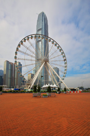 HONG KONG, DECEMBER 11, 2014: Hong Kong Special Administrative Region. The modern city on the ocean coast. Skyscrapers and huge ferris wheelのeditorial素材