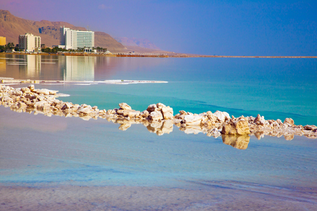 The Dead Sea resort in Israel. Turquoise smooth water and midday heat. The concept of medical and ecological tourismの写真素材