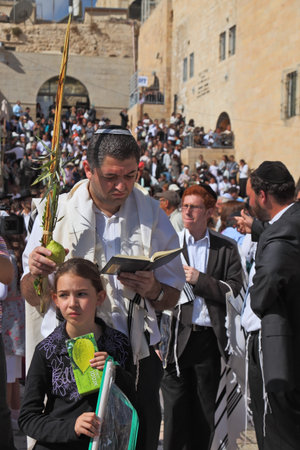 Jerusalem - October 16: the Sacred Western wall of the Temple. The Jewish family - the father in...