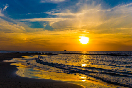 Warm winter in Israel. Bright  sunset on the Mediterranean coast in Caesarea. Concept of ecological tourismの写真素材