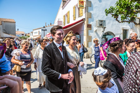 Saintes-Maries-de-la-Mer, Provence, France - May 25, 2015. The concept of ethnographic tourism. Participants in a procession in ancient dresses. Religious feast in honor of the Holy Maries in Provenceのeditorial素材