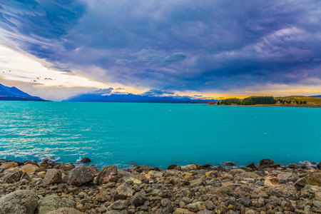 The coast of Lake Tekapo with turquoise water. Exotic journey to the New Zealand. Concept of active and ecological tourismの写真素材