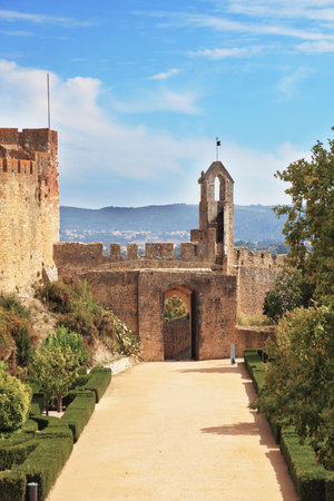 Palace of the Knights Templar in Portugal. Stone wall and the entrance to the parkのeditorial素材