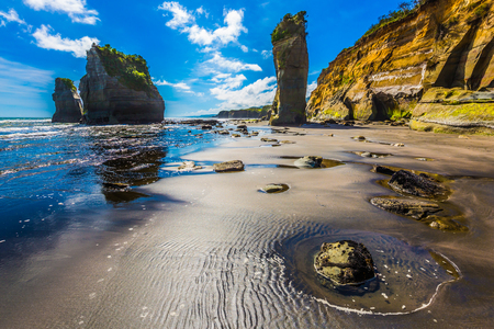 Picturesque rocks "Three Sisters" on the Pacific coast. The concept of active and phototourism. New Zealand, North Islandの写真素材
