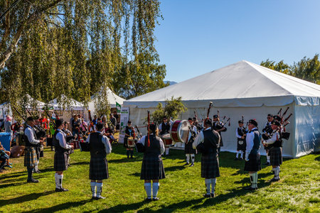 Ensemble of musicians on bagpipes. The harvest festival in Wanaka, New Zealand. The concept of rural and ecotourismのeditorial素材