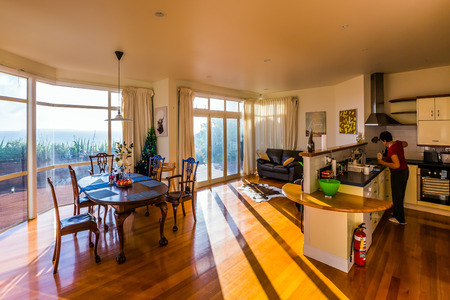 AUCKLAND, NEW ZEALAND - MARCH 4, 2018. Concept of luxury leisure and tourism. Sunny summer morning. Magnificent living room in an expensive villa on the Pacific coastの写真素材