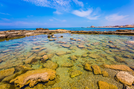 Flooded in the sea ruins and remains of port of King Herod in ancient Caesarea. Spring day in Israel. ÐÐ·ÑÐ°Ð¸Ð»Ñ. Concept of ecological and archaeological tourismの写真素材