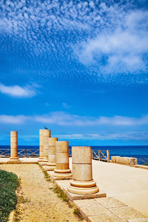 Ancient columns from the Roman period on the coast. National Park Caesarea, Israelの写真素材