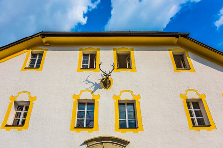 Facade of a monastery house near lake Koenigssee. Bavaria, Germany. The concept of active,...