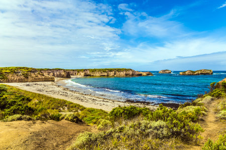 The concept of exotic, active and photo-tourism. Seashore and sandy beaches of the Pacific. Great Ocean Road of Australiaの写真素材