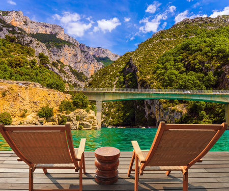 Big bridge across the canyon and river Verdon.  National park Merkantur, Provence, France The picturesque Verdon Gorge in the Mercantour Park. The Provence Alps, France. The tributary of the Durance River. Brightly green river waterの写真素材