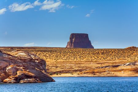 Grandiose cliffs - red sandstone outcroppings. Azure water of Lake Powell among the rocks of Monument Valley. Concept of active and photo tourismの写真素材