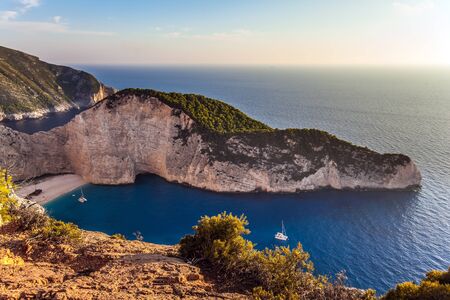 Greece. The magical island of Zakynthos. The cove with a small sandy beach. The famous rusty ship, Navajo Bay (Navagio Beach). The concept of a summer beach holiday and photo tourismの写真素材