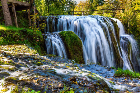 The small Croatian town of Slunj. Magnificent cascade of waterfalls on the Koran River. Magnificent...