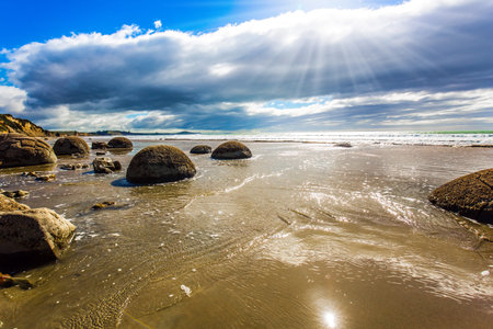 The South Island of New Zealand. Popular tourist attraction. Moeraki Boulders is the group of large...