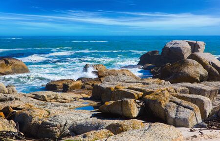 Coastline, beach and stones on the Atlantic coast. The concept of active, exotic and photo tourism. Fabulous port city Cape Town at the foot of Table Mountain の写真素材