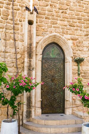 Warm summer evening. Century masonry walls. Old Yaffo - one of the most ancient cities of the world. The warm light of the setting sun.  Sunset. Concept active, informative and photo of tourismの写真素材