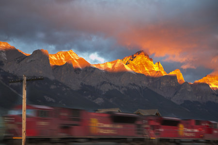 Freight train going with the big speed in winter mountains