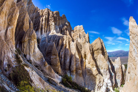 Sunset. Colossal clay peaked outliers - Clay Cliffs separated by narrow ravines. New Zealand.