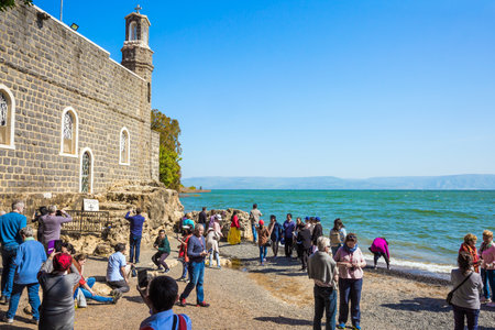 TABGHA, ISRAEL - FEBRUARY 15, 2020: Numerous pilgrims and tourists visited the holy church in Christian places of Israel. Sea of Galilee. Ethnographic, historical, religious and photo tourism conceptのeditorial素材