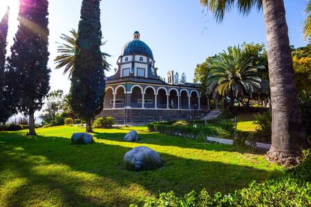Israel. The Catholic Church of the Beatitudes of the Italian female Franciscan monastery on Mount Bliss. The Sea of Galilee. Blooming huge park around the monastery. The concept of religious pilgrimageの写真素材