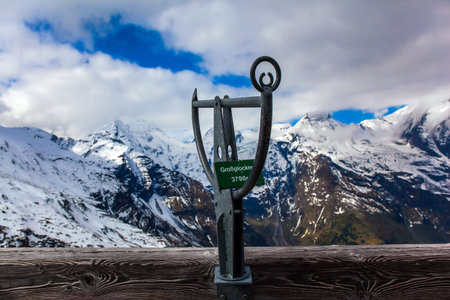 Pointer to the highest peak of the Alps - Grossglockner - 3798 meters. Austria. The first snow fell on Grossglockner Alpine Road. Ecological, active and photo tourism conceptの写真素材