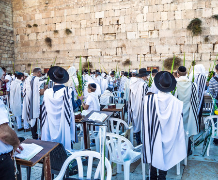 The blessing of the Cohenim. Solemn ceremony at the Western slope of the Temple Mount in the Old City of Jerusalem. Jews praying at the Western Wall. The concept of religious and photo tourismのeditorial素材