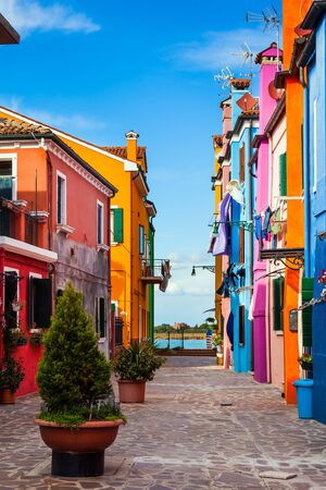 Burano is an island of colorful bright houses and the finest lace near Venice. Colorful linens are dried on the balconies. The concept of cultural, historical and photo tourismの写真素材