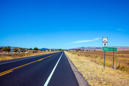 Route 66. U.S. Historic Motorway 66. Great car trip across America. The road sign is a symbol of historical road 66. The concept of automobile, active and photo tourismの写真素材