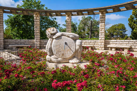 Sundial is carved in stone. Observation deck overlooking the Mediterranean Sea. Blooming rose garden. Magnificent park on the slopes of Mount Carmel in Israelの写真素材