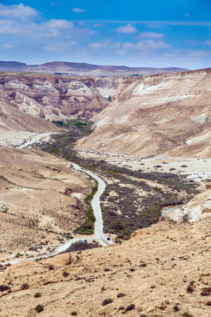 Start route. The magnificent gorge Ein Avdat. Picturesque ancient oasis in the Negev desert. Israel. Bird's eye view photo. The concept of active, environmental and photo tourismの写真素材