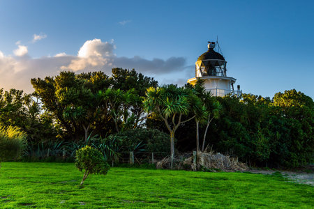 Southern Scenic Route. Snow-white picturesque lighthouse at sunset on the Pacific Ocean. South...